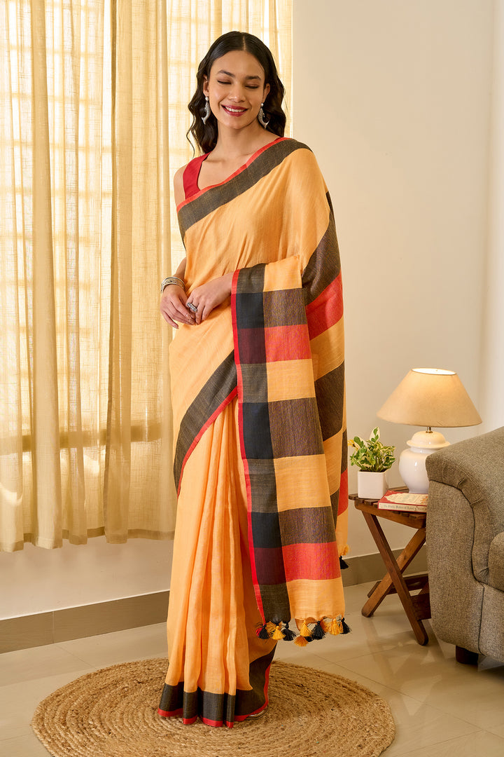 Teejh Soothing Peach, red and black Color Block Saree