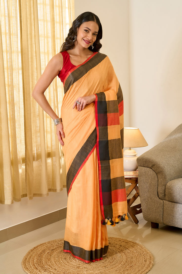 Teejh Soothing Peach, red and black Color Block Saree