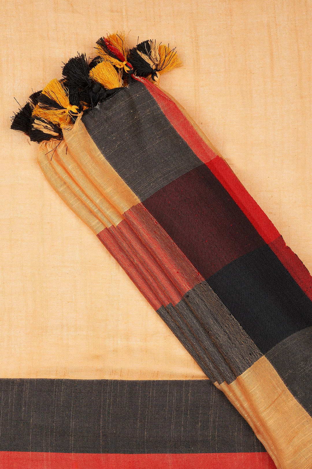 Teejh Soothing Peach, red and black Color Block Saree