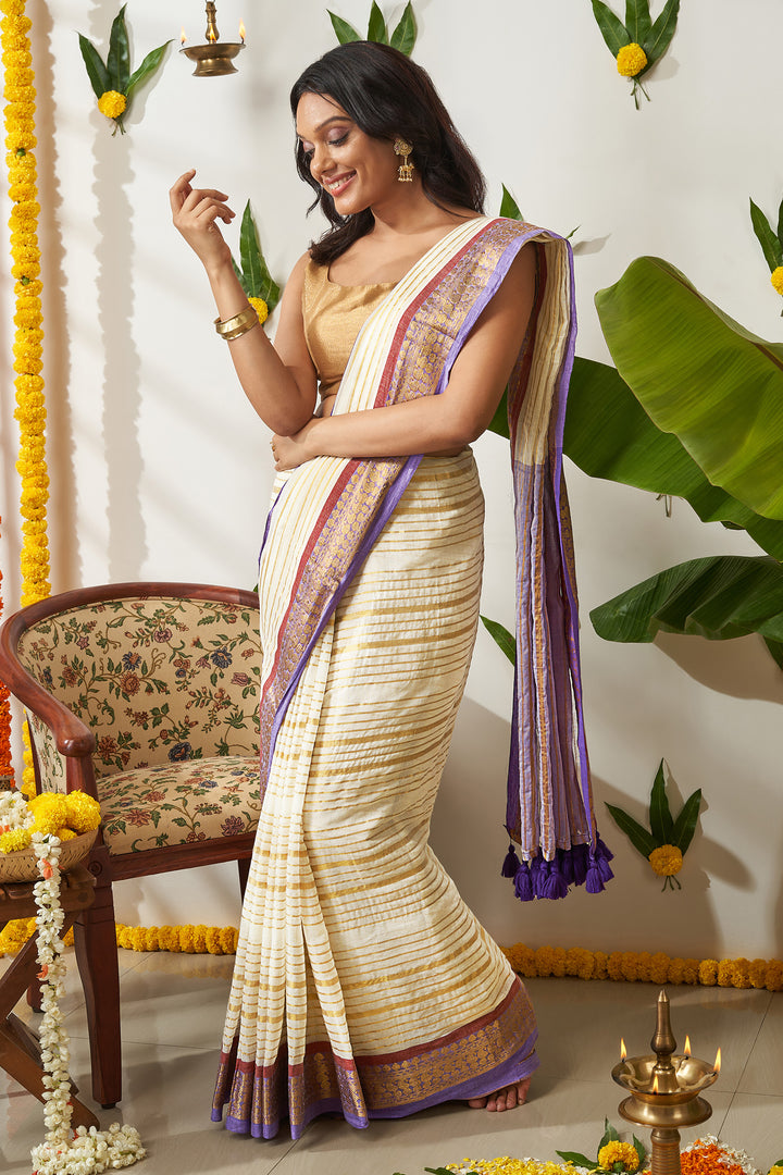 Teejh Malya Off white and Purple Zari Stripes Mul Cotton Saree