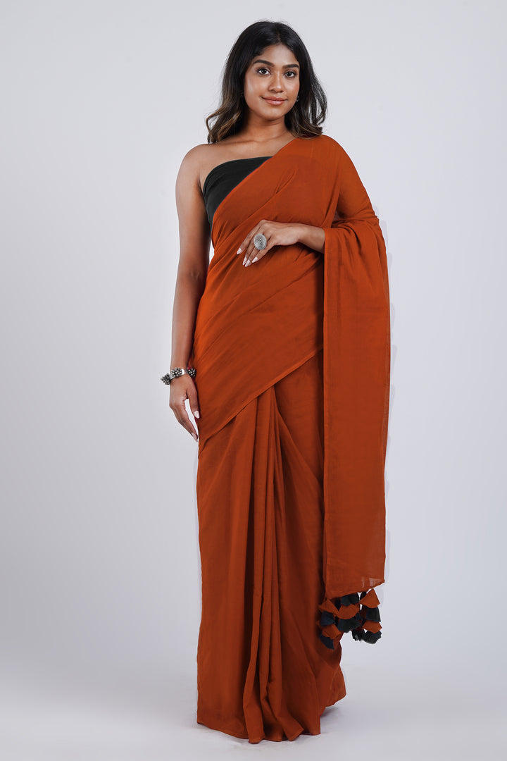 Teejh Dusk and Dawn Rust Orange  and Black Mulmul Saree